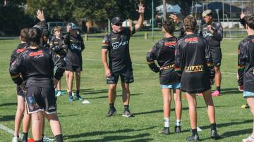 Dave Elvy works with western juniors during one of the Panthers Cubs clinics this week. Picture by James Arrow